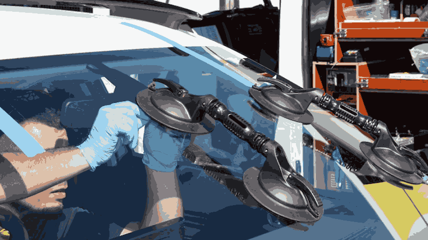 Technician performing windscreen repair in Brighton